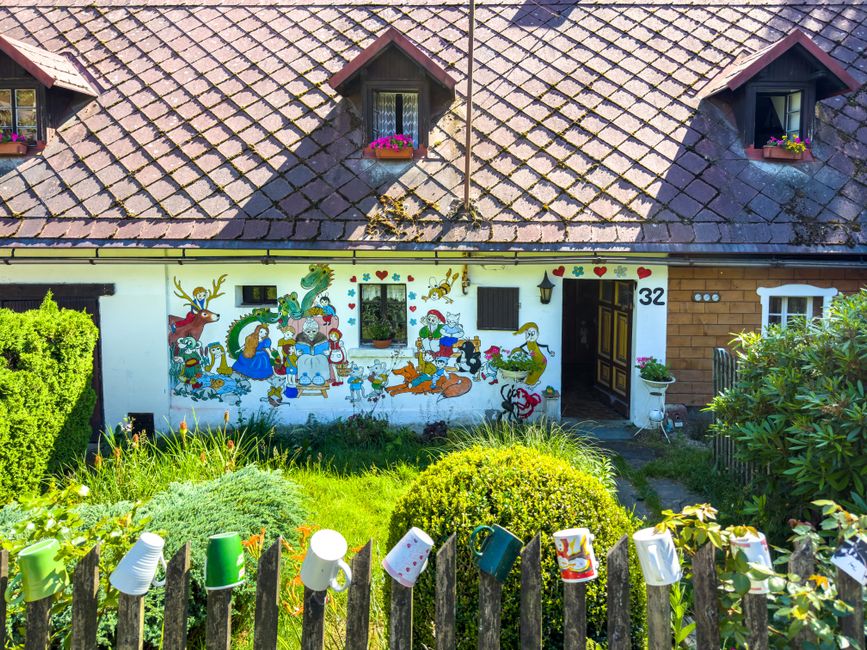 Painted exterior wall of a house with colored paint and window trim